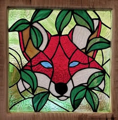 The Foxhole Cabin fox logo